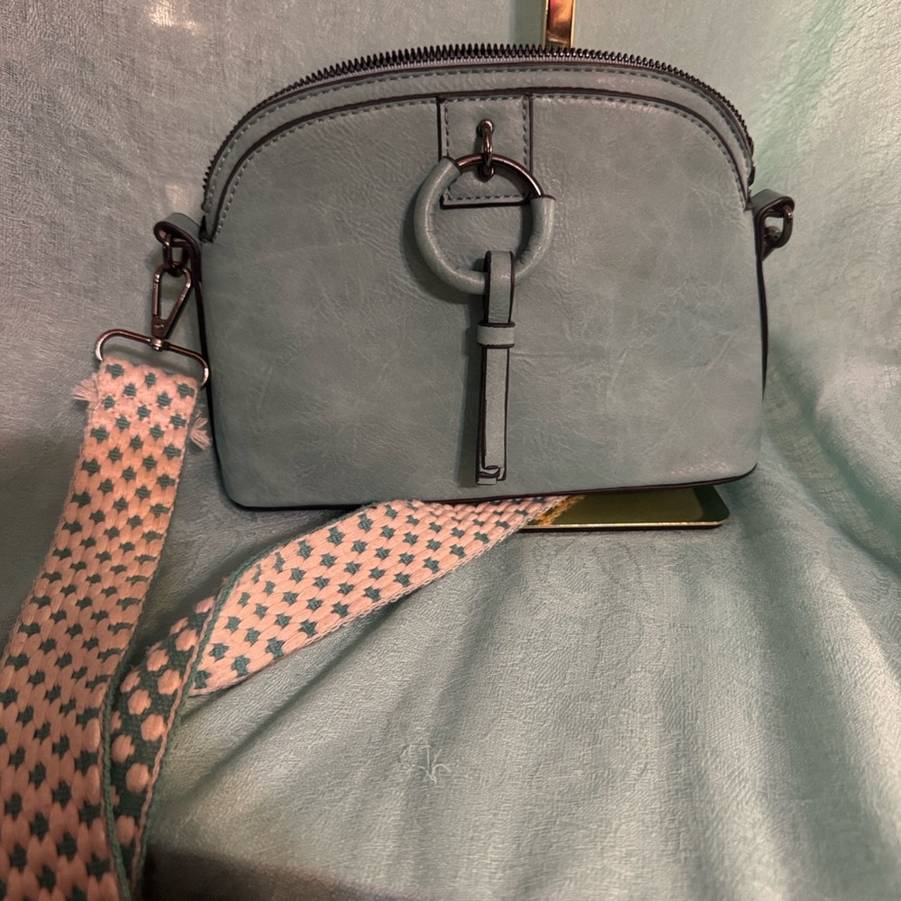 Elegant Blue Crossbody Bag with Patterned Strap